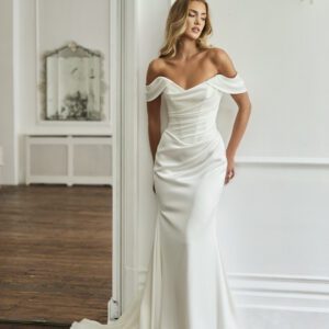 Suzanne Neville Eternelle Wedding Dress - Modern Sexy Fit and Flare Bridal Gown with Drop Waist, Sweetheart Strapless Neckline, Off the Shoulder Straps, Draping, Rouching details in Satin Fabric.