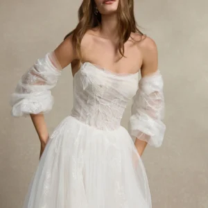 La Premiere Bryce Wedding Dress - Modern Romantic A-Line Bridal Gown with Drop Waist, Cat-eye Neckline, Detachable Long Sleeves, Corset Detail and Lace Fabric.
