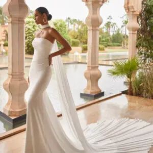 Rosa Clara Odette Wedding Dress - Beach Modern Sexy Fit and Flare Bridal Gown with Asymmetrical Waistline, Straight Strapless Neckline, Rouching Details and Crepe Fabric.