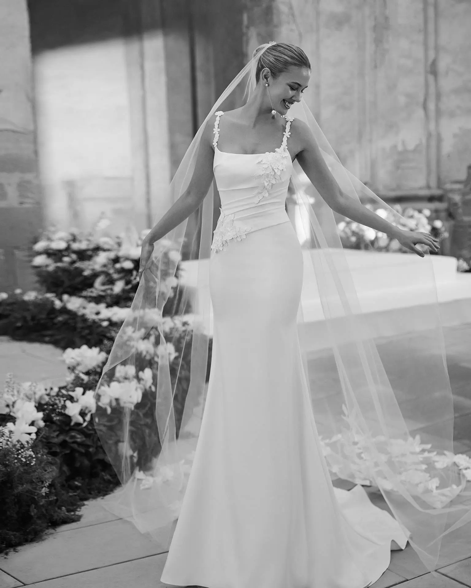 Rosa Clará Maca Wedding Dress - Beach Sexy Modern Mermaid Bridal Gown with Asymmetrical Waist, Squared Neck, Spaghetti Straps, Floral, Draping and Rouching Details in Crepe Fabric.