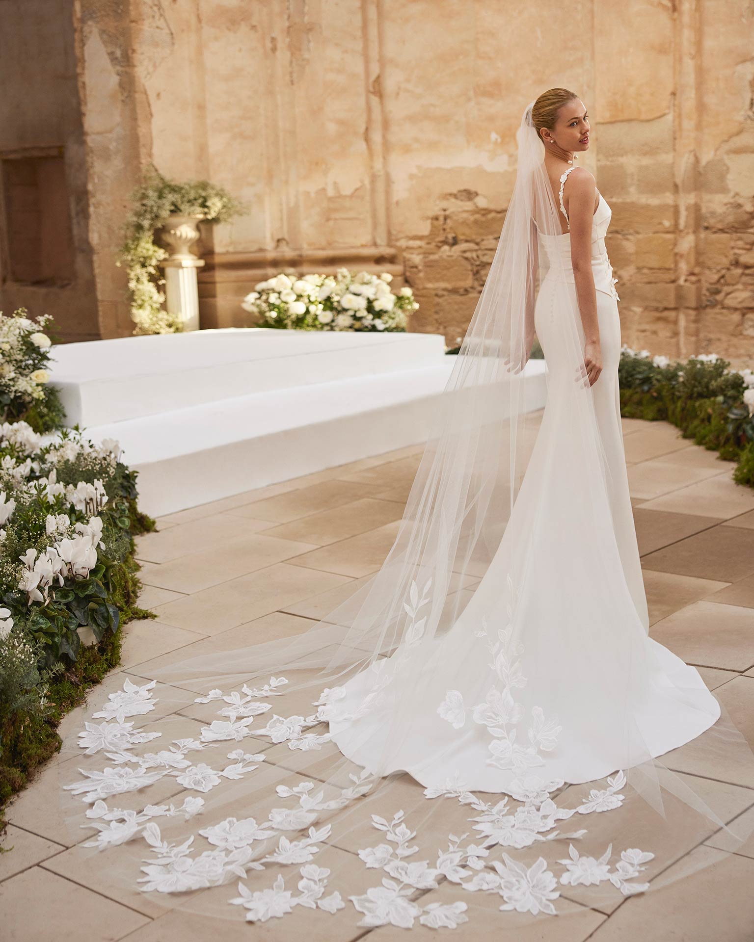 Rosa Clará Maca Wedding Dress - Beach Sexy Modern Mermaid Bridal Gown with Asymmetrical Waist, Squared Neck, Spaghetti Straps, Floral, Draping and Rouching Details in Crepe Fabric.