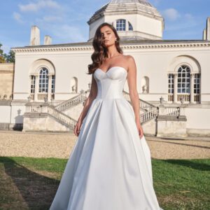 Suzanne Neville Seloura Wedding Dress - Classic Clean Modern Bridal Gown with Drop Waist, Strapless Sweetheart Neckline, Corset, Pleated Details in Satin Mikado.