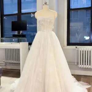 La Premiere Bryce Wedding Dress - Modern Romantic A-Line Bridal Gown with Drop Waist, Cat-eye Neckline, Detachable Long Sleeves, Corset Detail and Lace Fabric.